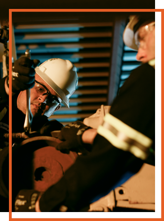 Hoist and Crane technicians working together on crane equipment