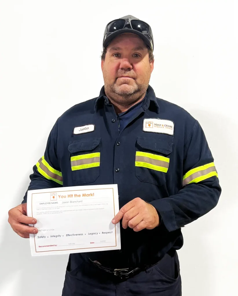 Jason B holding five marks certificate